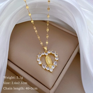 Macro detail of gold Virgin Mary heart pendant with cubic zirconia and chain measurements