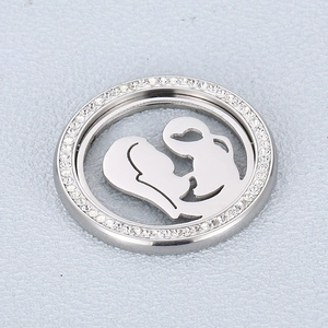 Detailed view of silver mother and child necklace pendant with sparkling rhinestones