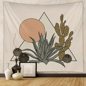 Detail of minimalist desert cactus tapestry hanging on wall in a modern room