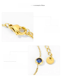 Close-up of gold-plated bracelet with blue zircon, lobster clasp and s.steel tag