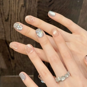 Short handmade cat eye press-on nails with silver bows and 3D colorful dots