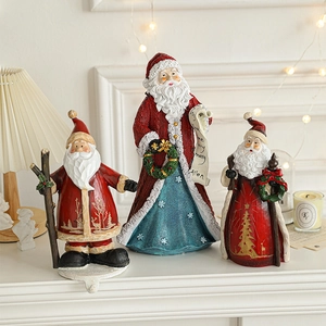 Three creative resin Santa Claus figurines on a mantel for festive Christmas decoration