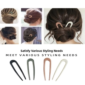 U-shaped hair pins in four colors shown on hair buns and laid flat for styling