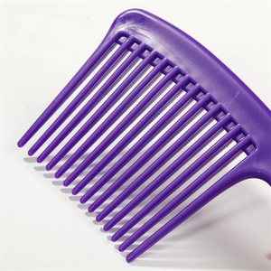 Purple wide-tooth plastic hair comb with thick teeth for curly hair on white background