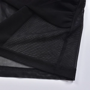 Close-up of black mesh fabric showing semi-transparent texture and durable stitching