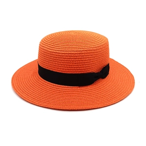 Retro orange straw flat top boater hat with black ribbon bow for summer beach sun protection