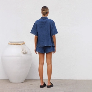 Vintage dark blue denim set with short sleeve shirt and shorts shown from the back view