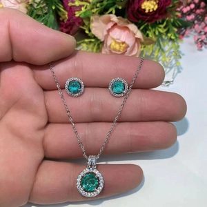 Halo design necklace and earrings jewelry set with round Paraiba blue zircon accents