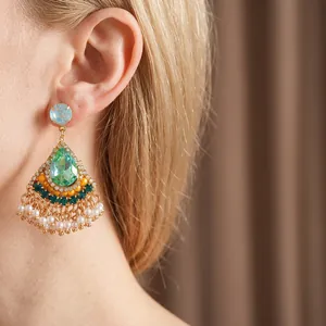 Vintage gold drop earrings with green stones and pearl tassels in baroque court style