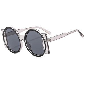 Retro oversized round sunglasses with translucent smoky grey frames and black inner layer