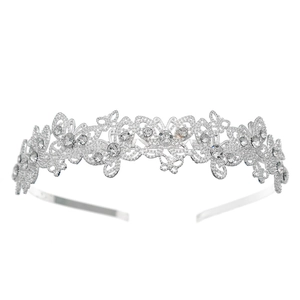 Detailed close-up of a silver hollow butterfly headband with sparkling white rhinestones