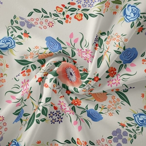 Close-up of floral tapestry fabric with roses and poppies on a beige background