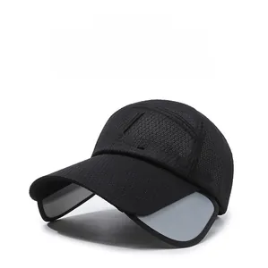 Detail showing retractable sun visor panels on black breathable mesh baseball cap