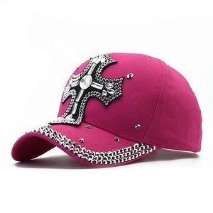 Sparkly pink baseball cap with rhinestone cross design and sequined glitter brim