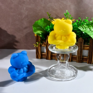 Macro detail of buff bear silicone mold crafts in bright yellow and blue finishes