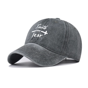 Detail of washed grey cotton baseball cap with Faith OVER Fear and cross print
