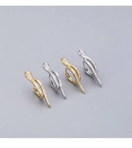 Detail of snake-shaped 925 sterling silver hoop earrings with pave cubic zirconia stones