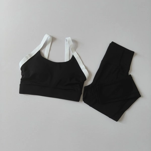 Close-up of black and white yoga set featuring sports bra and high-waist leggings