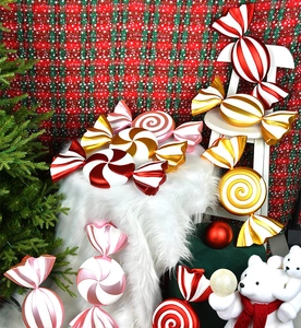 Macro detail of large 55cm red and white striped Christmas candy hanging ornament