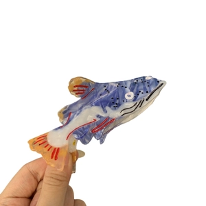Creative fish-shaped hair claw clip in deep blue acetate with hand-painted patterns
