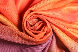 Detailed macro shot of breathable orange and purple gradient mesh fabric texture