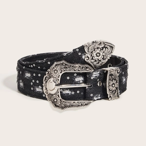 Vintage black denim belt with silver embossed floral buckle and distressed details