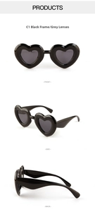 Three-angle product view of C1 black heart shaped sunglasses with gray lenses