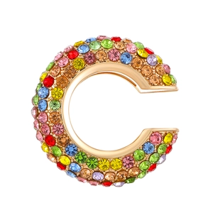 Sparkling C-shaped ear cuff featuring colorful pavé-set rhinestones in a gold-plated base