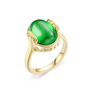 Vintage gold titanium steel ring featuring an oval green chalcedony gemstone on white background