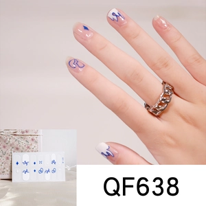 Detail of pink and blue heart flame nail stickers set QF638 on nails with gold ring