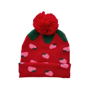 Kids strawberry knit beanie with red pompom and jacquard pattern for winter warmth
