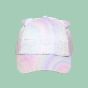 Close-up of tie-dye kids baseball cap featuring cat ears and heart embroidery details