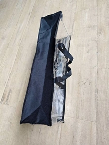 Waterproof clear PVC tote bag with black non-woven fabric trim and sturdy handles