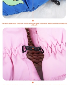 Detail of waterproof kids ski mittens showing security clips and windproof cuffs