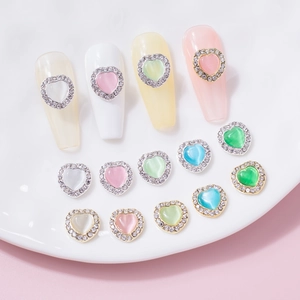 Cat eye heart nail art charms with rhinestones and metal base in various colors