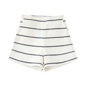 Detail of high-waisted shorts featuring blue stripes and fine woven texture