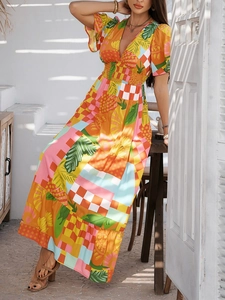Detailed close-up of V-neckline and pineapple print on summer high-waist boho dress