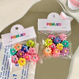 Candy colored flower hair clips for kids in matte finish and pastel macaroon tones