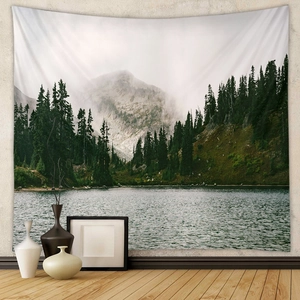 Detailed landscape tapestry showing misty forest mountains and a serene lake reflection