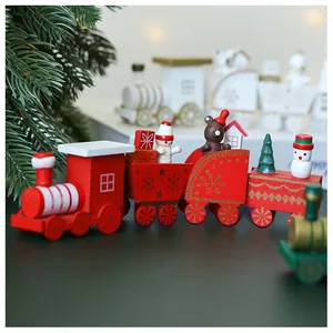 Close-up of red wooden Christmas train decoration with snowman and bear figurines