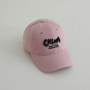 Detailed view of pink cotton baseball cap featuring 3D embroidered black CHINA lettering