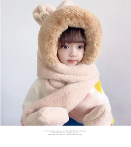 Close-up of thick plush fleece texture on children pink 3-in-1 hat scarf and gloves set