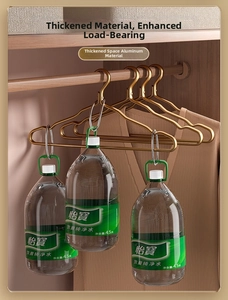 Detail of heavy-duty golden aluminum hanger showing high load capacity with water jugs