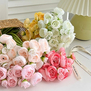 Artificial ranunculus bouquets in pink, yellow, and white for elegant home decor and weddings