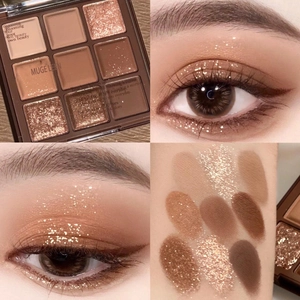 Macro shot of 9-color earthy tone eyeshadow palette showing matte and glitter textures