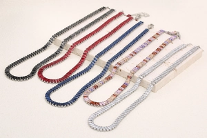 Detail shot of five 18K gold plated tennis necklaces with vibrant zirconia stone accents