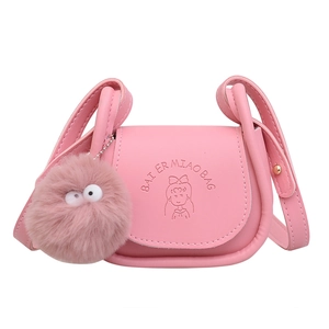 Pink mini crossbody bag with cartoon engraving and cute brown plush pom-pom charm
