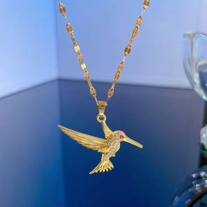 Titanium steel hummingbird necklace with sparkling crystals and red gemstone pendant