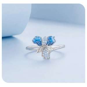 Macro shot of S925 sterling silver ring showing blue enamel iris and sparkling zircon pavé