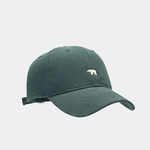 Detail view of cotton baseball cap with white polar bear embroidery and metal buckle